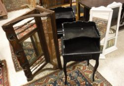 A pair of black painted bedside tables in the French manner, a brass double bed head,