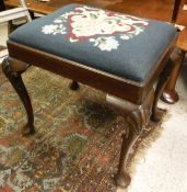 A mahogany stool on cabriole legs with shell carving to the knees to pad feet