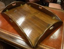 A mahogany butler's tray with folding sides