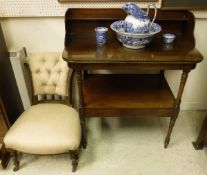 A 19th Century two tier mahogany wash stand with galleried top encompassing a shelf,