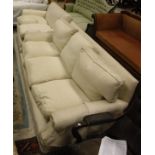 WITHDRAWN A three seat sofa together with a two seat sofa in ground cream upholstery