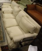 WITHDRAWN A three seat sofa together with a two seat sofa in ground cream upholstery