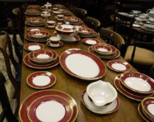 A Tokyo china puce and gilt decorated dinner service