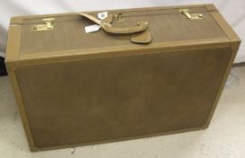 A "Diva i Santi" suitcase with faux elephant hide and leather covering