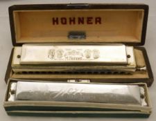 A Horner Chromonika III harmonica, in case, together with a Hero harmonica,