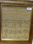 An 18th Century needlework sampler depicting the alphabet, numerals and dated 1734,