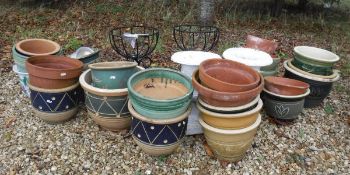 A large collection of garden pots and planters