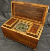 A Victorian rosewood and parquetry inlaid tea caddy of sarcophagus form,