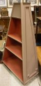 A painted display stand of obelisk tapering form with assorted shelves,