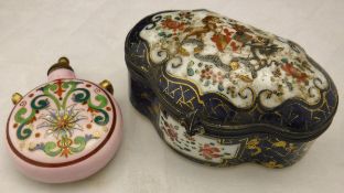 A porcelain shaped hinged lidded box with armorial decoration in the Chinese style,