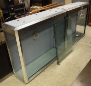 A pair of modern SDS steel and glass display cabinets with sliding lockable doors