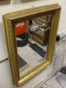 A giltwood and gesso framed rectangular wall mirror and a modern overmantle mirror