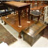 A 20th Century mahogany writing table with leather inset top above two drawers,