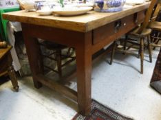 A pine plank top table with two drawers to the red painted base supported by four square section