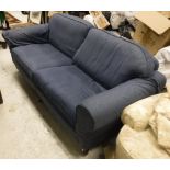 A blue leaf patterned upholstered three seat sofa,