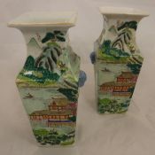 A pair of 20th Century Chinese polychrome decorated vases of square form,