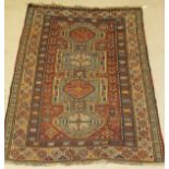 A Kasak rug, the central panel set with four repeating medallions on an aqua blue ground,