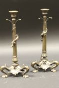 A pair of late 19th Century Elkington bronze candlesticks in the Empire taste,