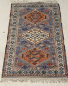 A Caucasian rug, the sky blue ground with three central medallions,