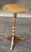 A 19th Century oak occasional table, the circular top above turned column, to three cabriole legs,