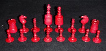 An Anglo Indian carved bone and red-stained bone chess set, height of King, 8 cm, height of pawn, 3.