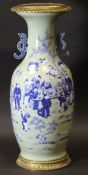 A 19th Century Chinese celadon glazed and blue and white decorated baluster shaped vase,