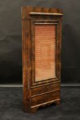 A 19th Century Continental mahogany free standing corner cabinet in the Biedermeier taste,