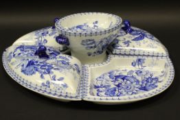 A 19th Century blue and white pottery passion flower design hors d'oeuvres set,