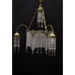 An early to mid 20th Century gilt brass and glass drop electrolier in the style of Hector Guimard,