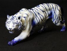 A Royal Doulton "Blue Flambé" figure of a stalking tiger designed by Charles Noke and painted by