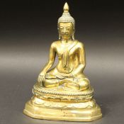 A Sino Tibetan bronze figure of the Buddha seated in lotus position upon a lotus leaf decorated