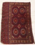 A Bokhara rug, the six elephant foot guls within a stepped border,