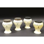 A set of four early 19th Century cream ware pharmaceutical drug jars of accentuated baluster form,