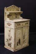 A Regency pine and chinoiserie decorated chiffonier, gilt decorated on a cream ground throughout,