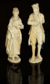 A pair of 19th Century Dieppe type carved ivory figures of a lady and gentleman in 18th Century