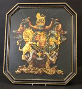 An early 19th Century hand painted Royal Coat of Arms on a dark green background,