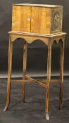 A 19th Century rosewood and inlaid cabinet on stand of small proportions,