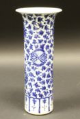 A 19th Century blue and white Chinese cylindrical vase with flared rim,