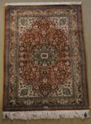An Eastern silk rug,
