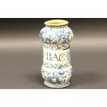 A late 17th / early 18th Century faience drug jar with all over blue and white scrolling floral