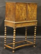 A 19th Century Continental olive wood cabinet on stand,