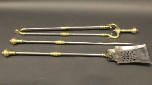 A 19th Century brass and steel three piece fire iron set with brass finials and collars,