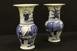 A matched pair of 19th Century blue and white Chinese baluster shaped vases with flared rims,