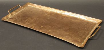 A Newlyn School rectangular beaten copper tray, stamped to base "J.