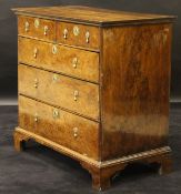 An 18th Century yew and mulberrywood chest of two short over three long drawers,