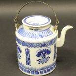 A Chinese blue and white porcelain teapot with allover floral spray and script decoration to the