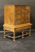 An early 18th Century walnut veneered and boxwood strung chest on stand,