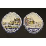 A pair of 19th Century Dutch polychrome Delft ware wall plaques,