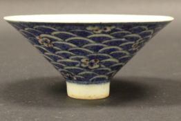 A Chinese polychrome decorated tea bowl of conical form,