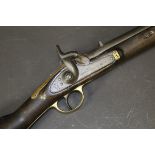 A Victorian carbine with hammer action, the barrel with various proof marks,